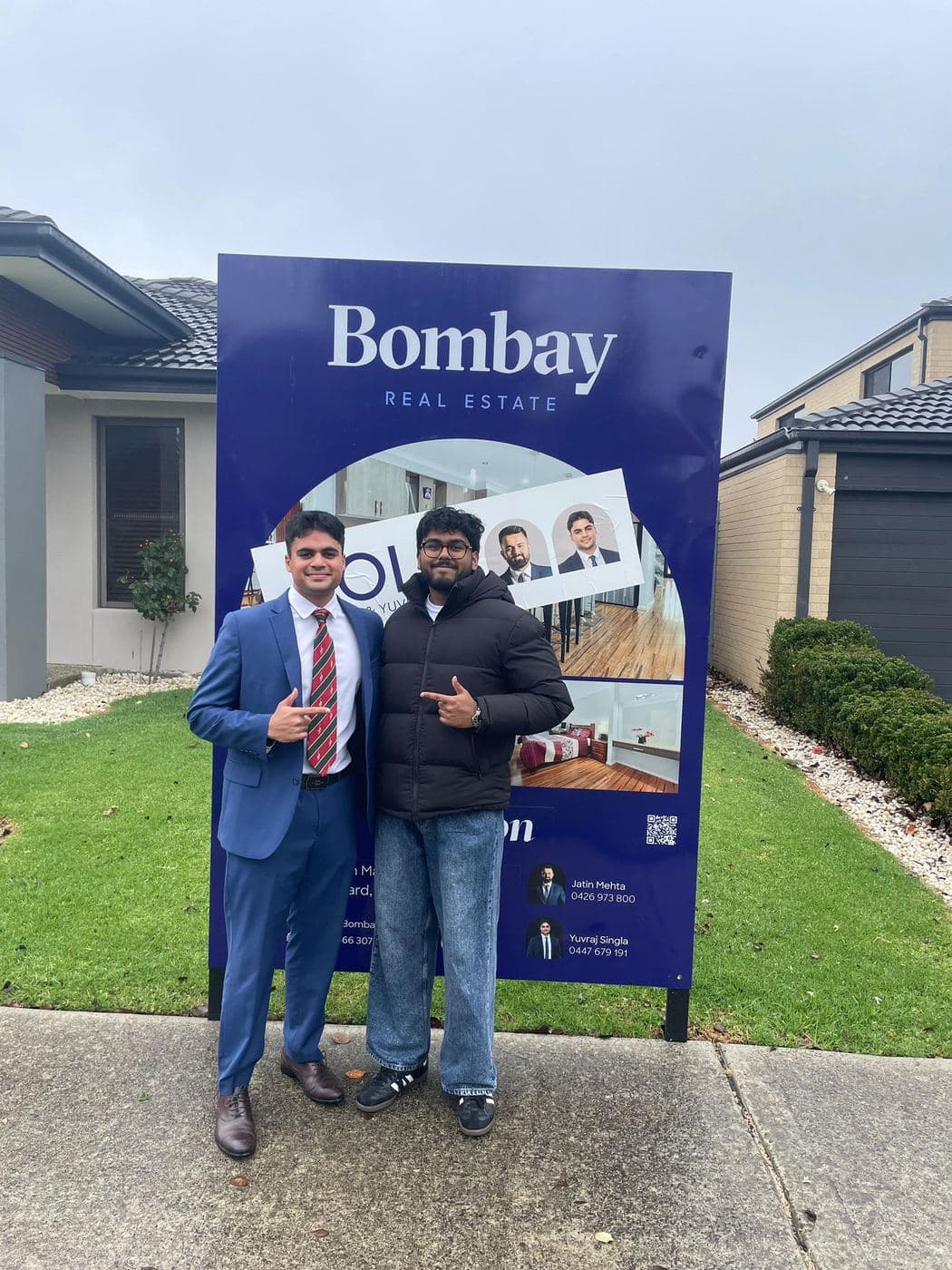 Agent and buyer at a Bombay sold board