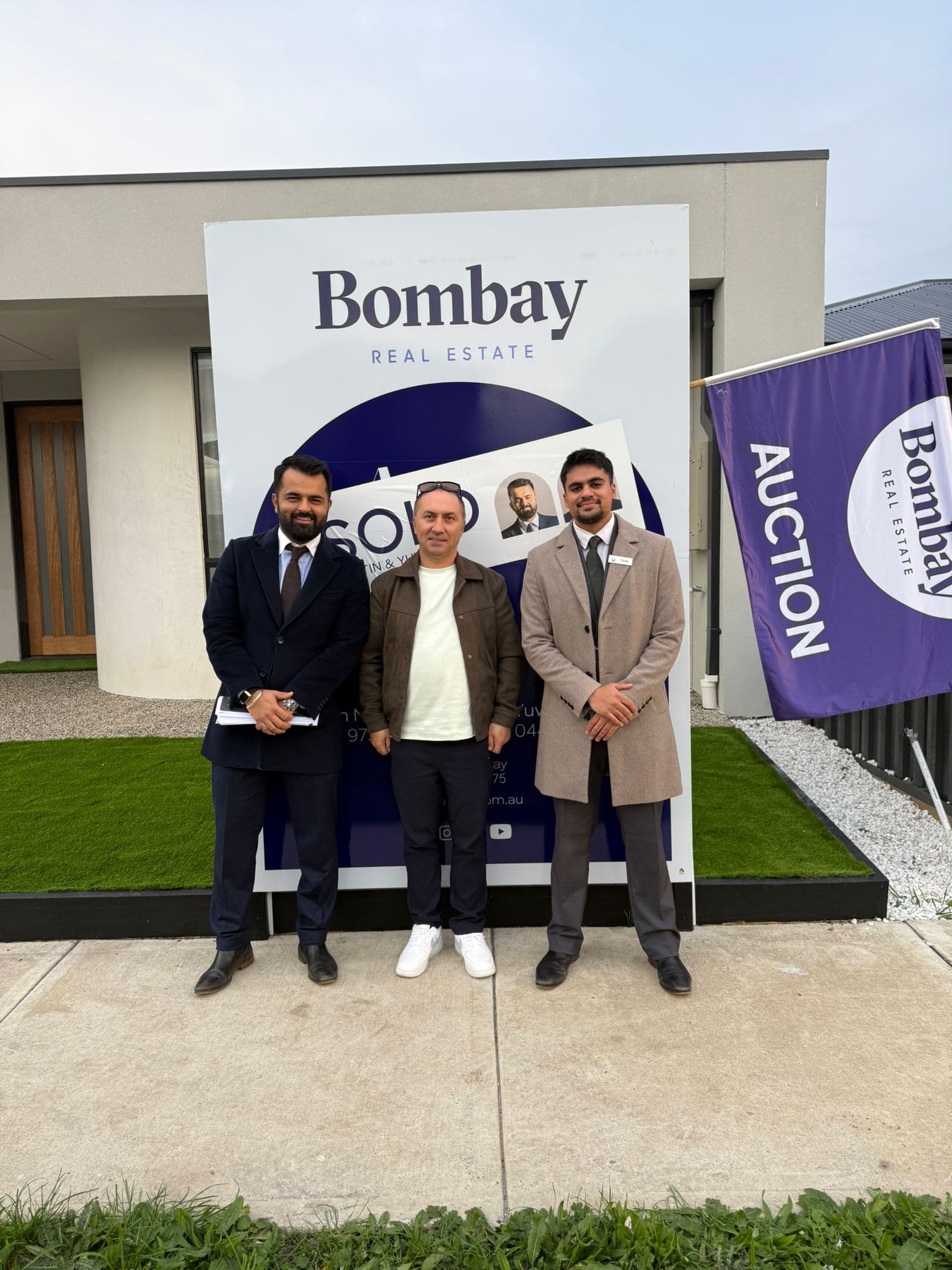 Three of the team on auction day at a rendered home